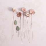 Handcrafted ceramic large pink and white  flower stems with soft glazes displayed on a white table. Each flower features a flexible copper wire stem for easy adjustment.
