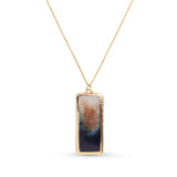 Gold Necklace with a gold and black rectangular pendant on a white background