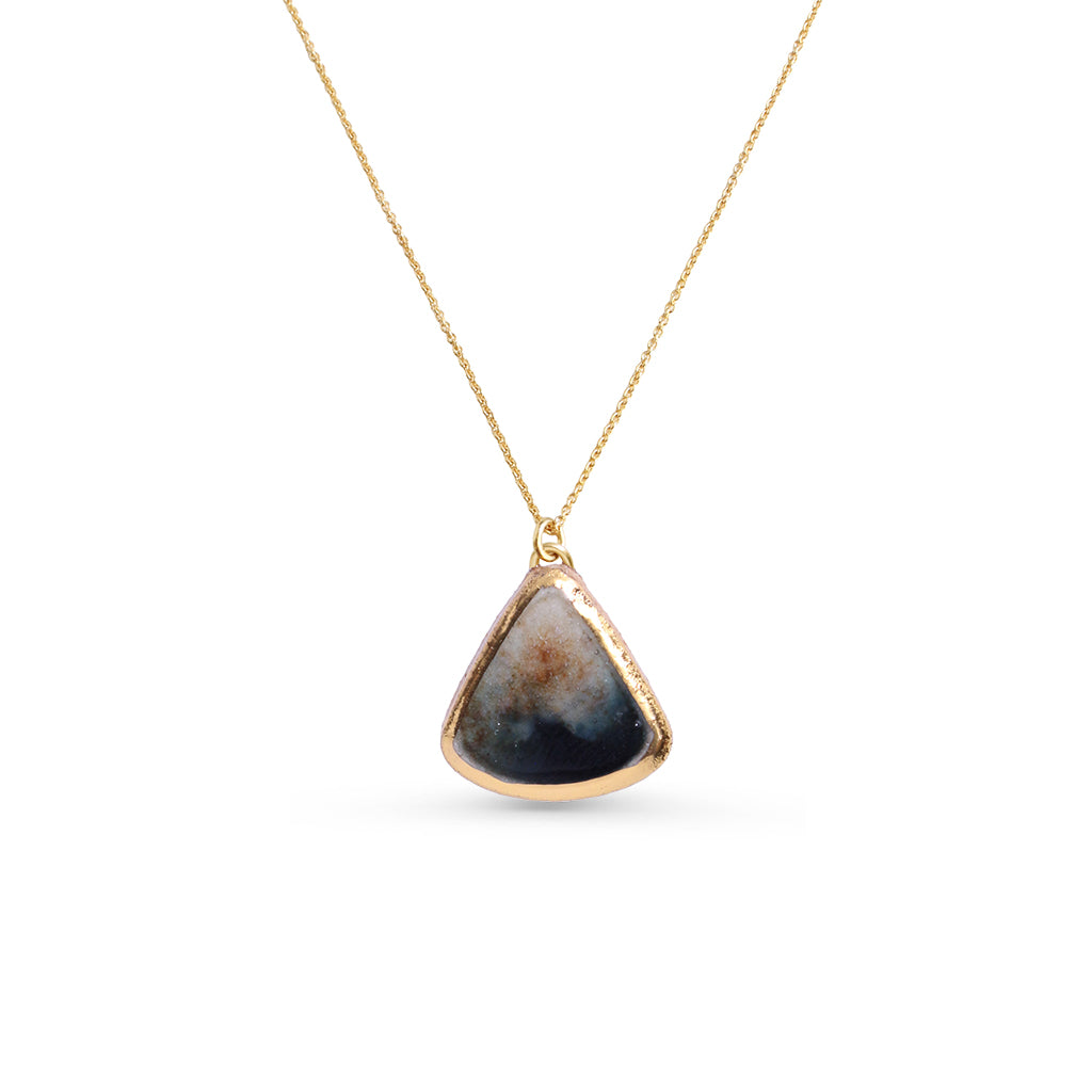 Gold Necklace with a triangular pendant on a white background