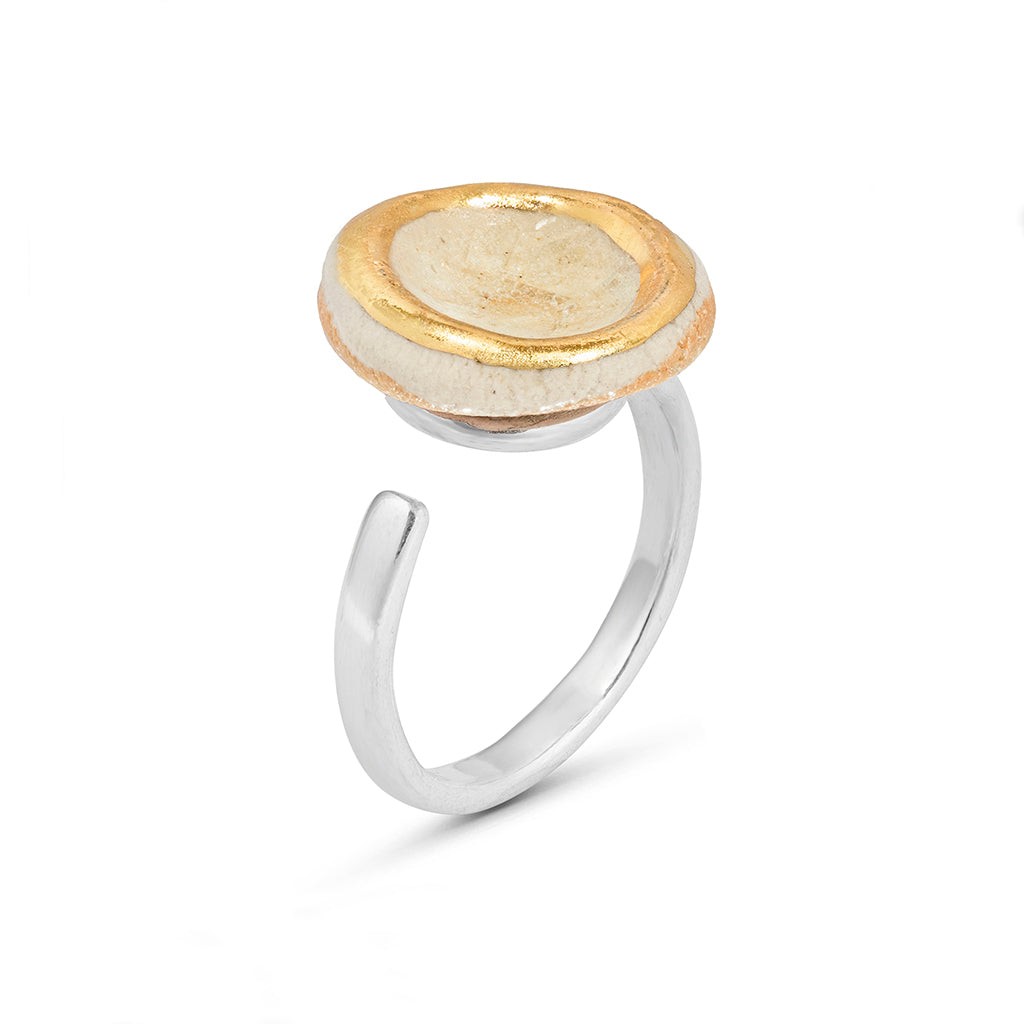 Side view of crystal clear glass small round sterling silver adjustable ring gold lustre