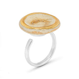 Side view of crystal clear glass large round sterling silver adjustable ring outlined in gold lustre