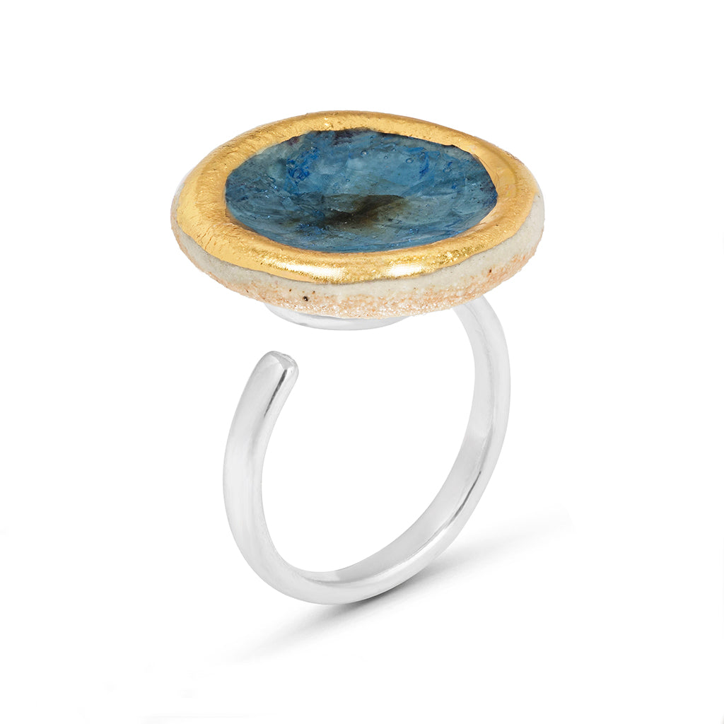Side view of blue reef glass large round sterling silver adjustable ring outlined in gold lustre