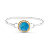 Turquoise blue gradient lagoon crackled glass round charm outlined in gold lustre on a silver plated latch bangle