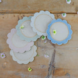 All 5 pastel coloured coasters spread on table