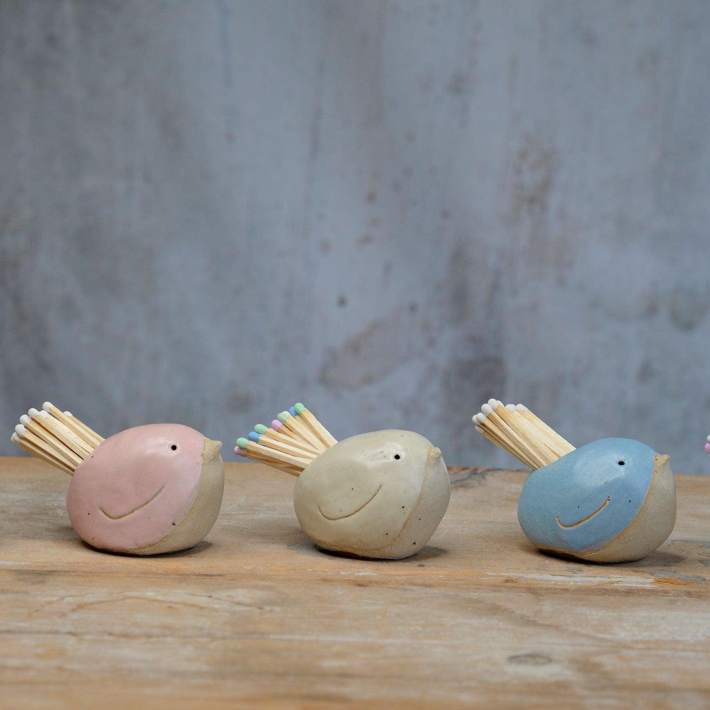 Pink, yellow and blue bird match pots