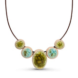 Recycled aqua blue and lime green crackled glass ceramic oval and circular beaded cord necklace.