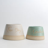 Large Top Dog bowl next to small personalised green bowl