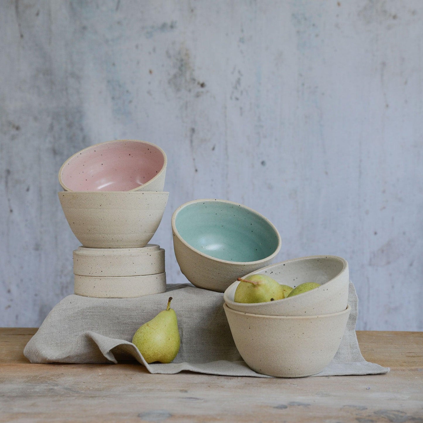 Different levels and angles of cereal bowls with pears