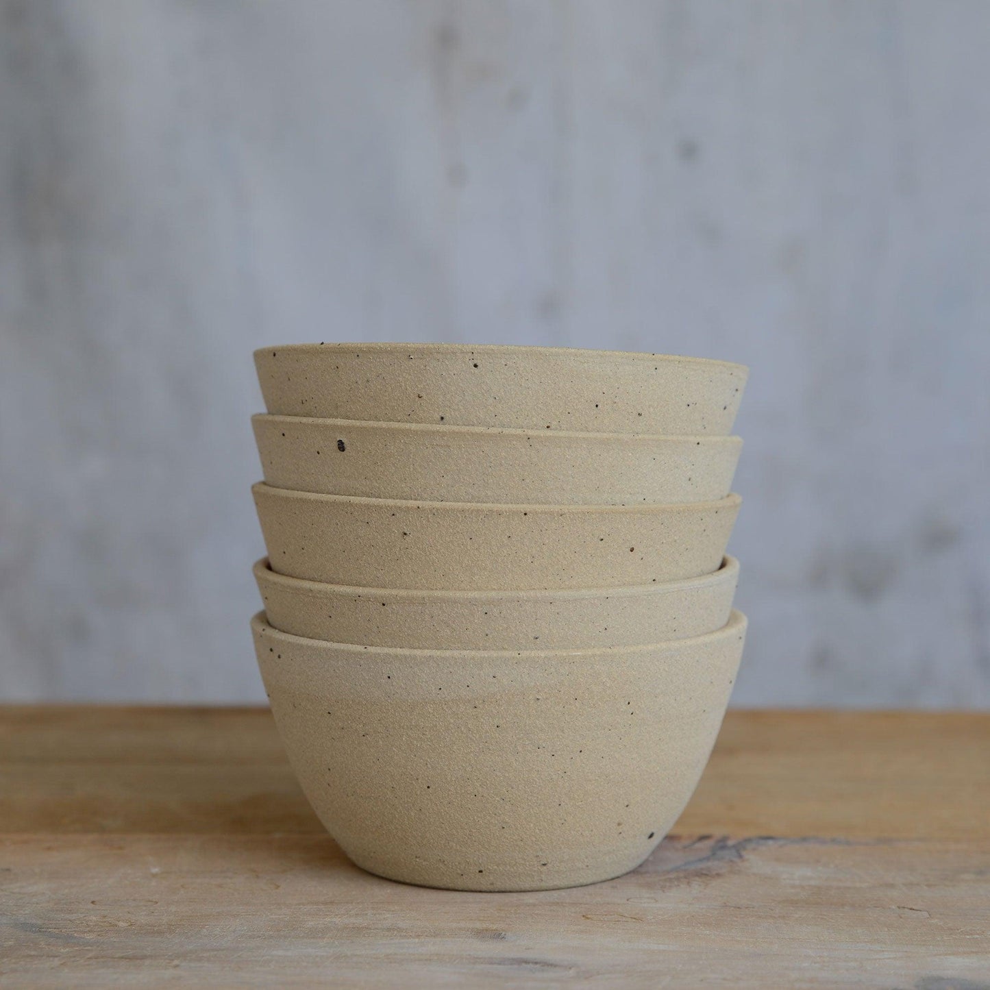 Stack of 5 stoneware cereal bowls