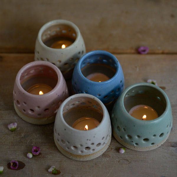 All 5 pastel tealights with lit candles from above