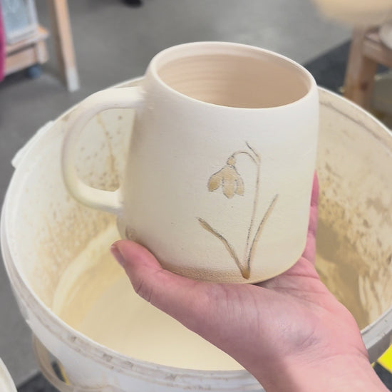 Video showing the process of glazing our birth flower mugs