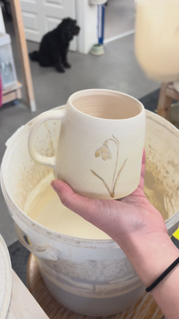 Video showing the process of glazing our birth flower mugs