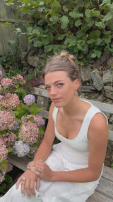Video showing pieces of our Dawn jewellery: our teardrop pendant and earrings and our small and large ring. Each pieces features pale pink glass on a ceramic base with gold lustre detailing. 