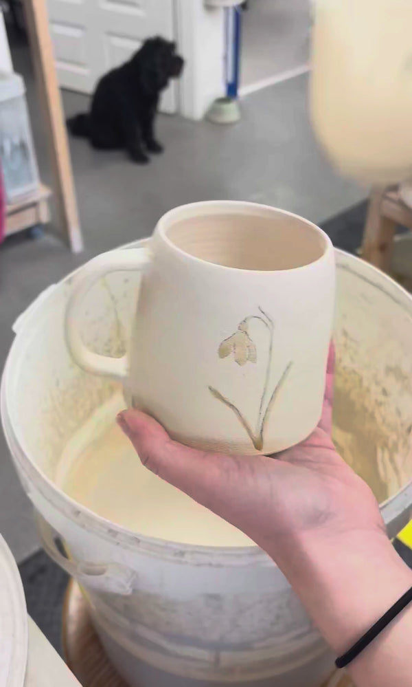 Video showing the process of glazing our birth flower mugs