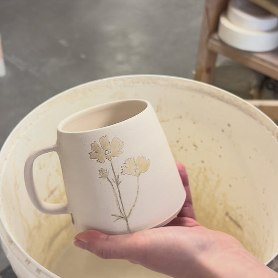 Video showing the process of glazing our birth flower mugs