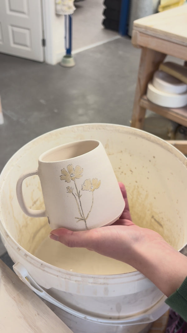 Video showing the process of glazing our birth flower mugs