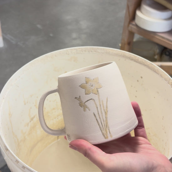 Video showing the process of glazing our birth flower mugs