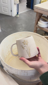 Video showing the process of glazing our birth flower mugs