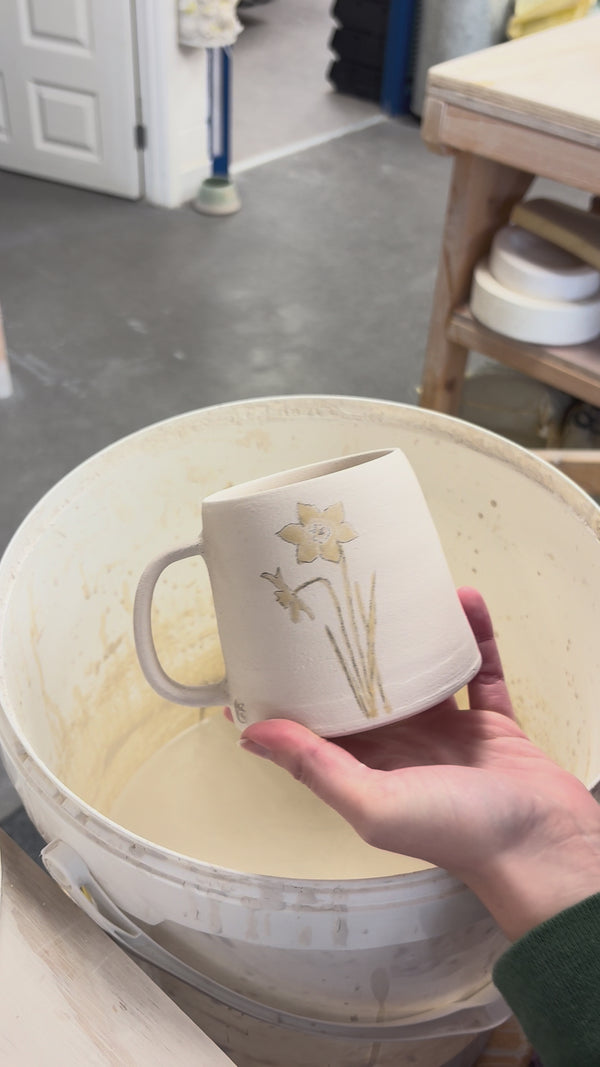 Video showing the process of glazing our birth flower mugs