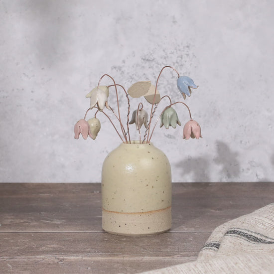 Pastel drop flower stems displayed in a handcrafted speckled vase – artisan home décor by Habulous.