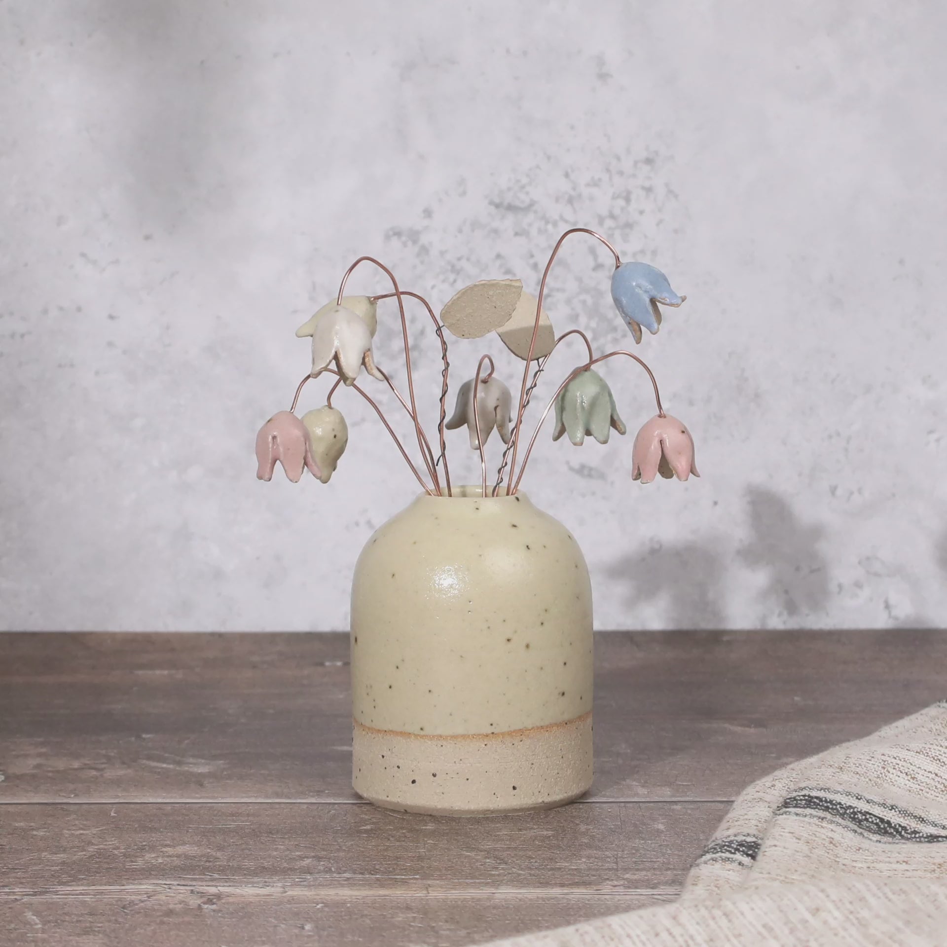 Pastel drop flower stems displayed in a handcrafted speckled vase – artisan home décor by Habulous.