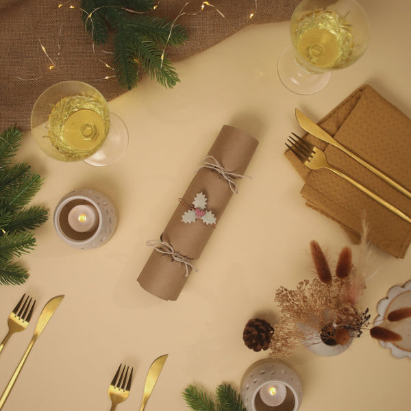 Stop motion video showing a Christmas cracker opening up to reveal a range of handmade ceramic pieces including ceramic worry stones and jewellery