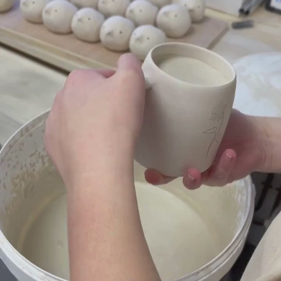 Video showing the process of glazing our birth flower mugs