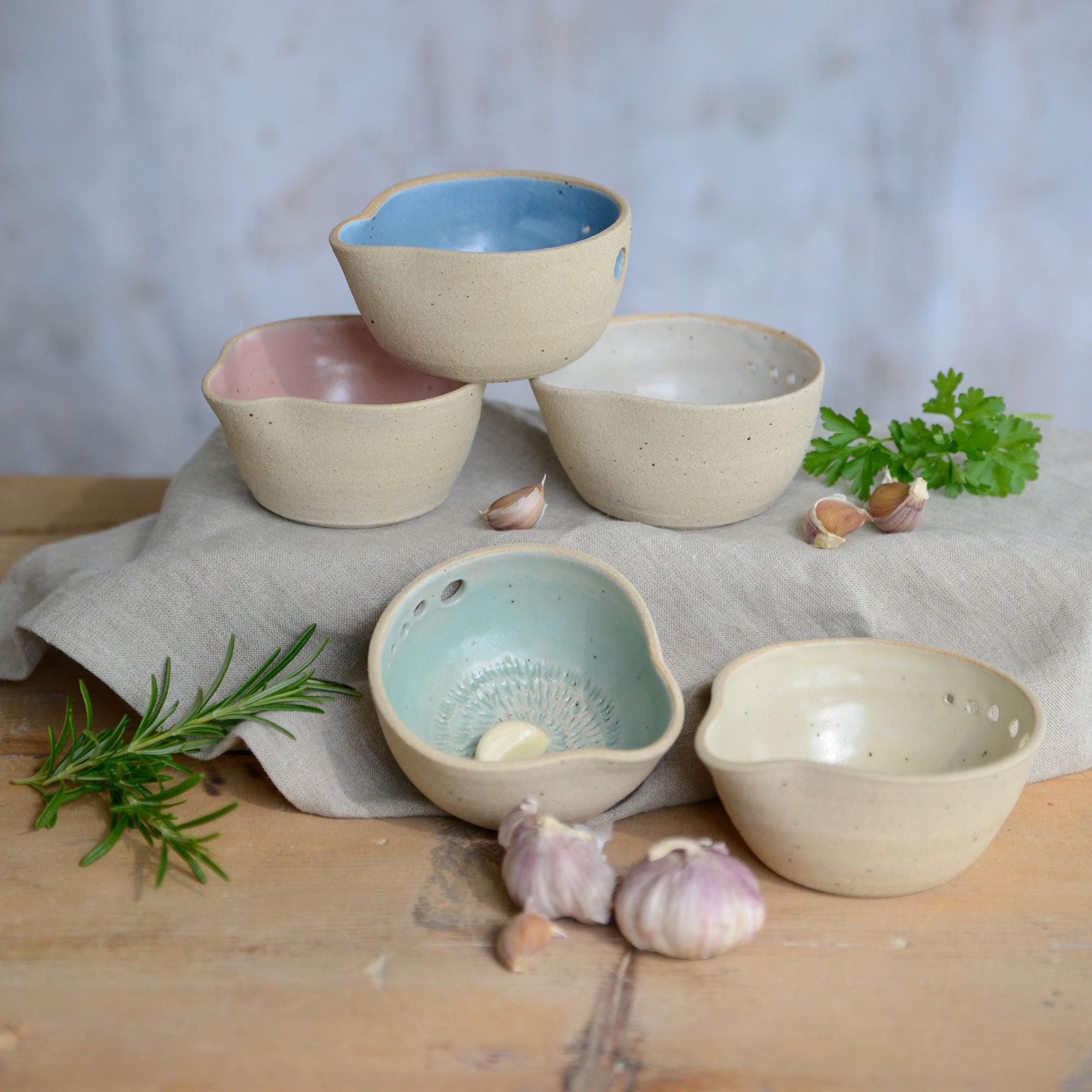 All 5 pastel coloured herb bowls on different levels with herbs