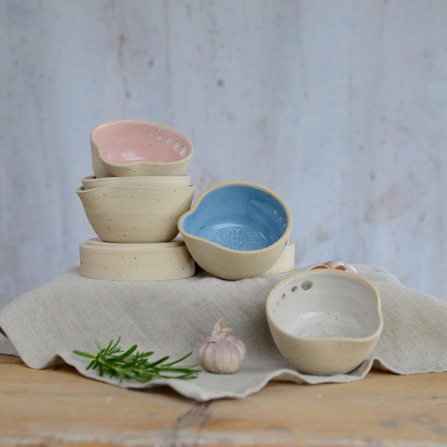 Stacked pastel herb shredder bowls on different levels