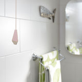 Pink light pull handle hanging in bathroom