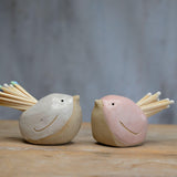 White and pink birds filled with pastel and white matches