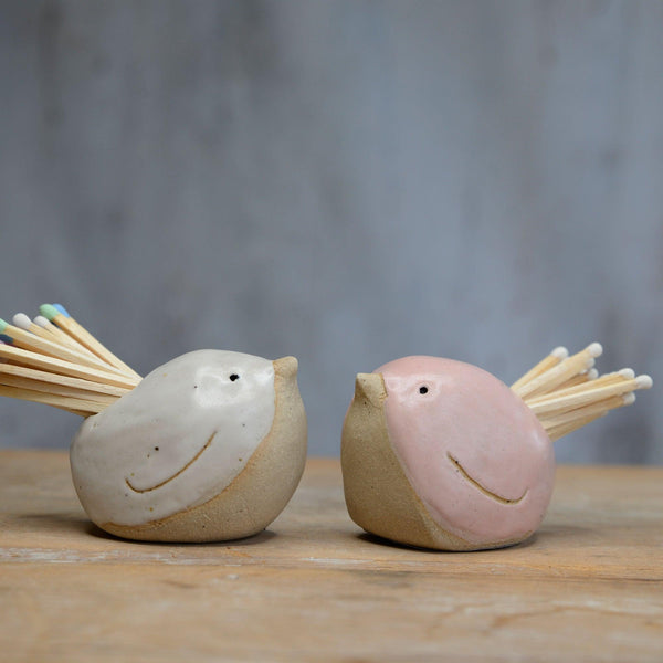 White and pink birds filled with pastel and white matches