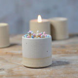Close up of white glaze and flecked stoneware on pot