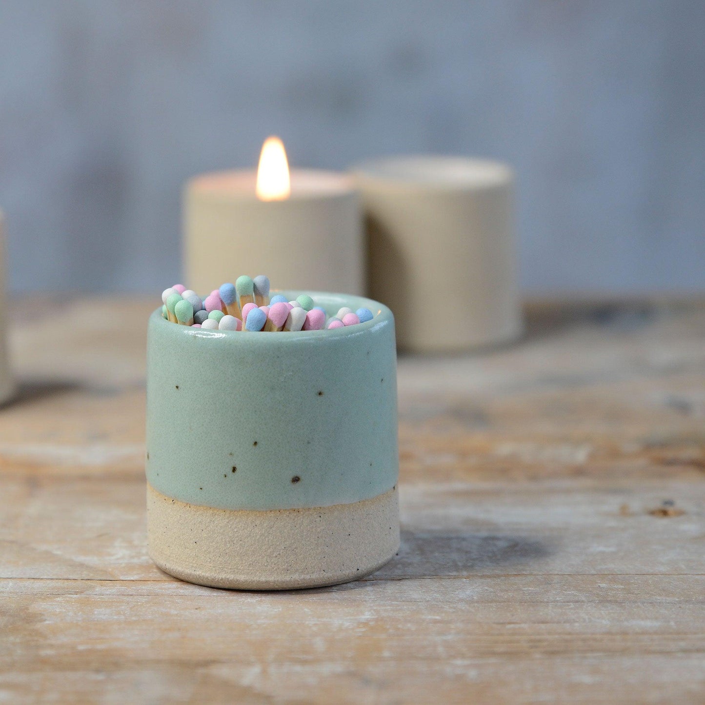 Close up of green glaze and flecked stoneware on pot