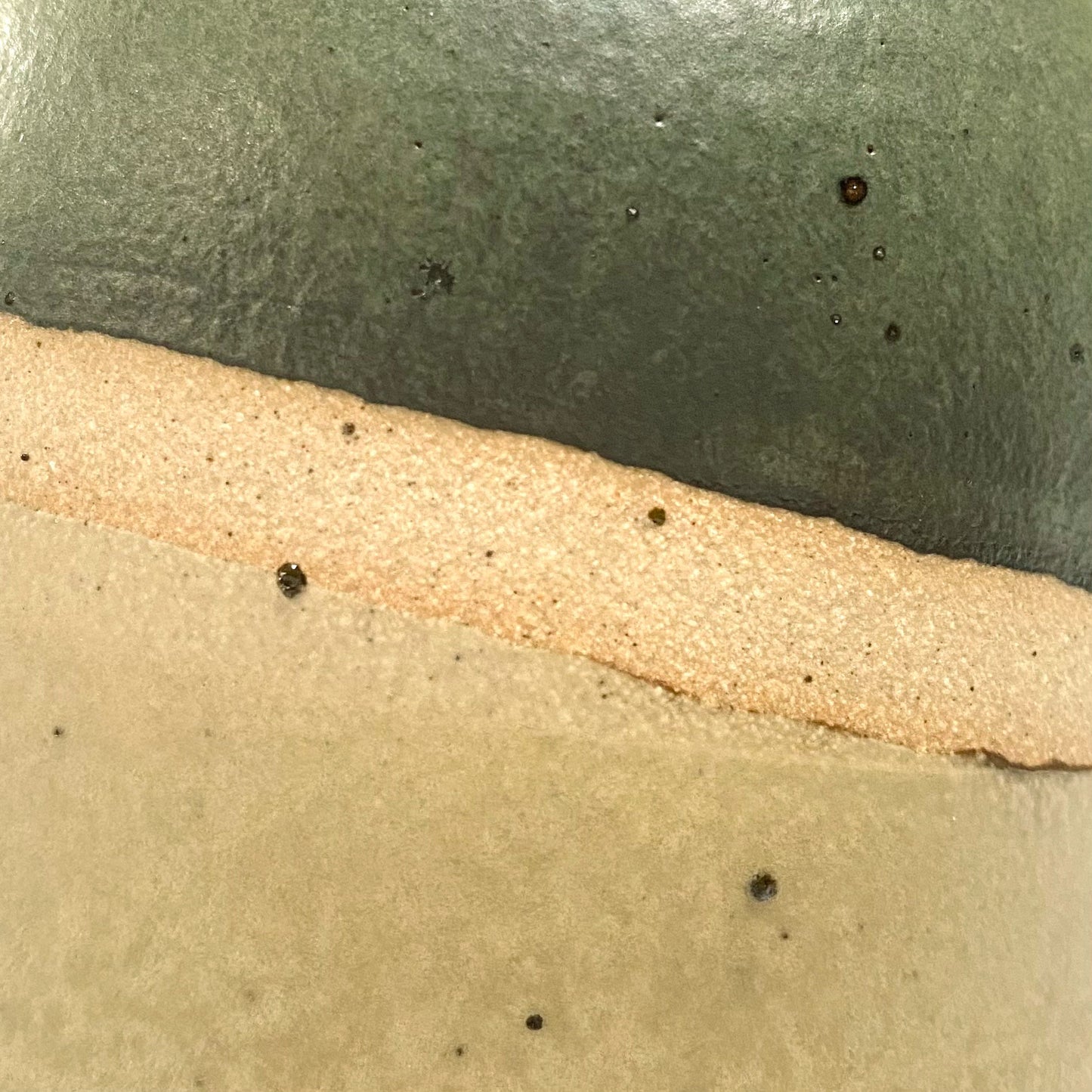 Close up of natural clay flecks showing through the glaze on the pourer