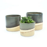 Set of 3 plant pots showing the glaze and exposed clay stripe on the exterior