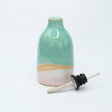 Steel and rubber nozzle next to the oil pourer