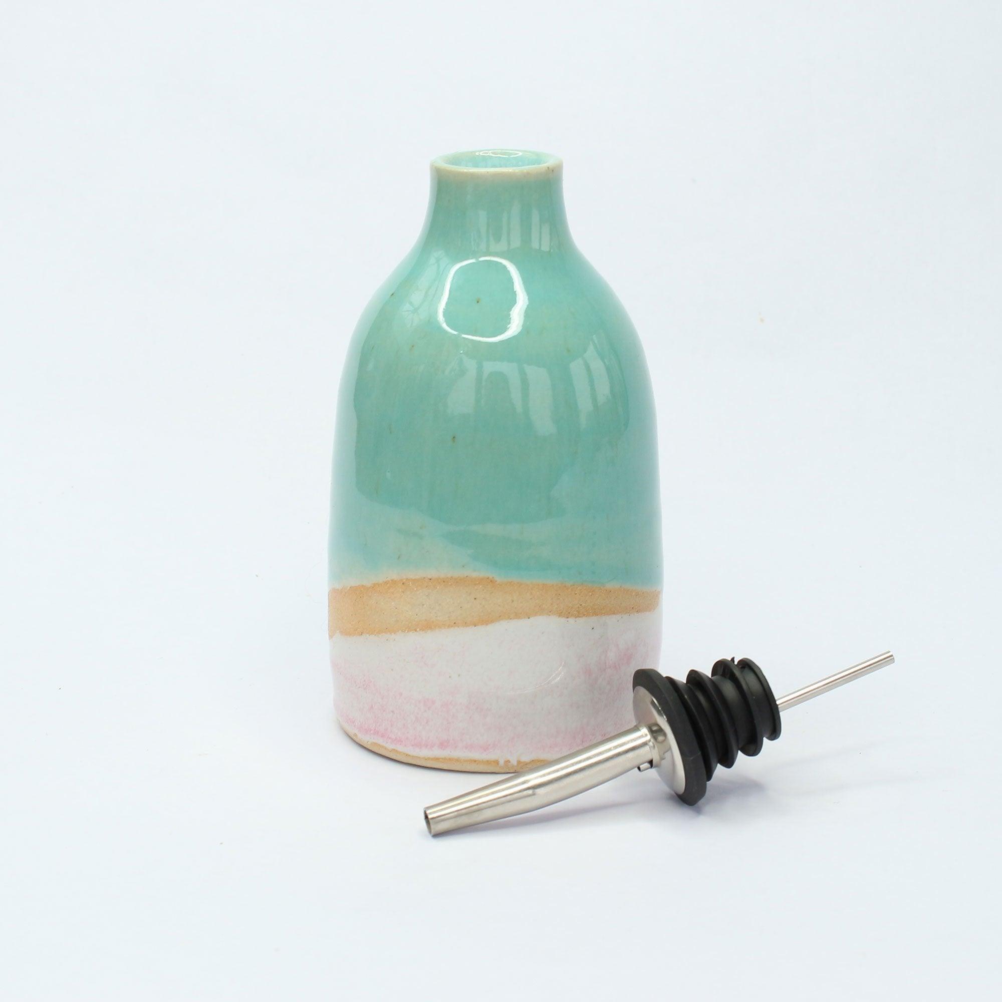 Steel and rubber nozzle next to the oil pourer