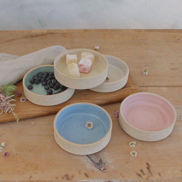 5 pastel nibbles bowls on table filled with blueberries and turkish delight