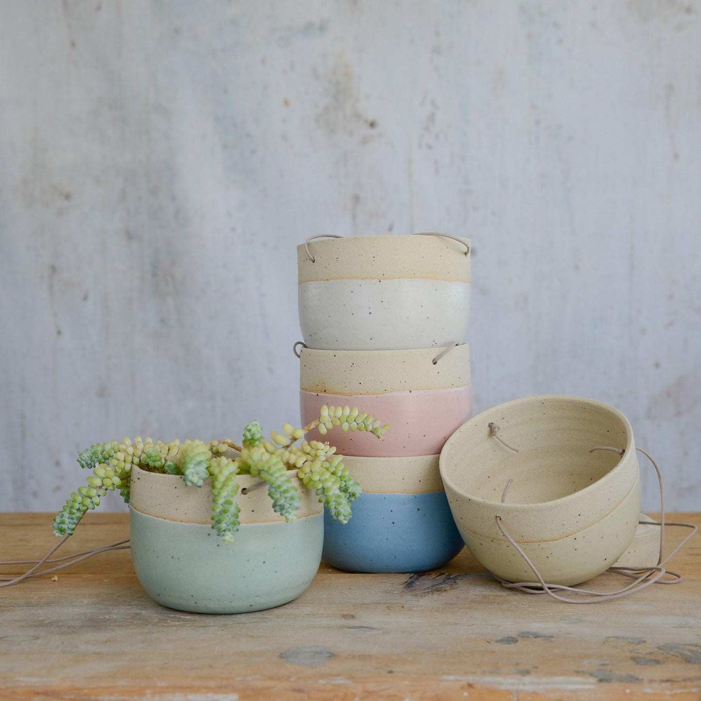 All pastel coloured planters at different angles
