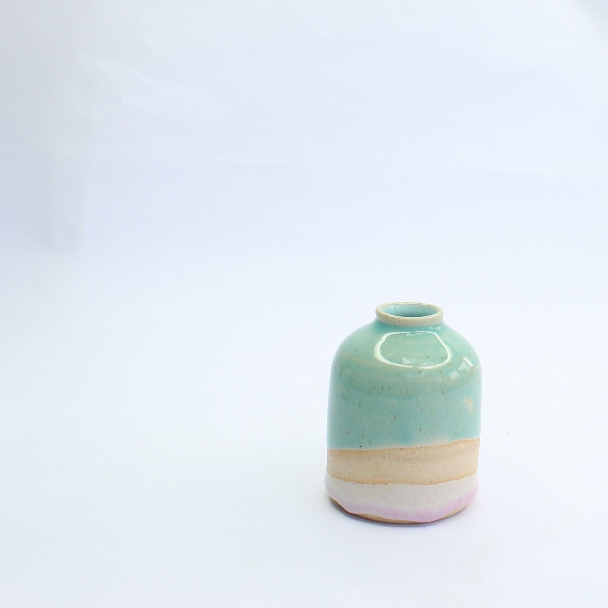 Side view of the mini Shoreline vase showing the glossy speckled turquoise glaze