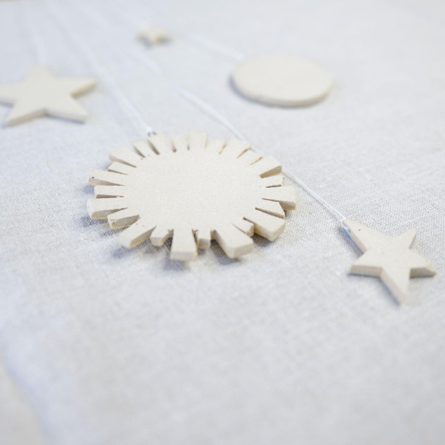 Blank stoneware underside of hanging shapes